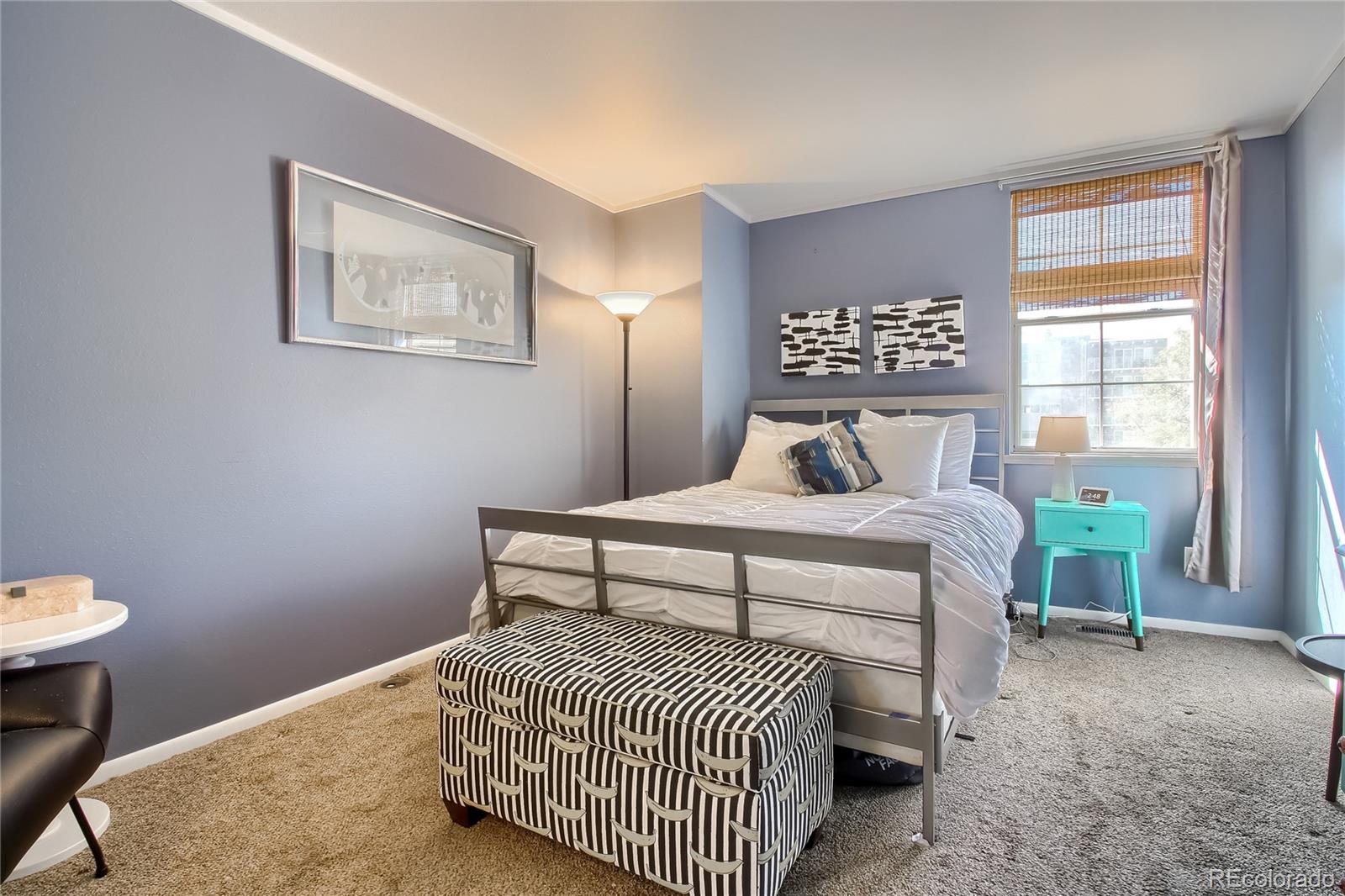 1300 Garfield Street, Unit 2 Denver, CO 80206 - Photo 17 of 34 a bedroom with a bed and a window