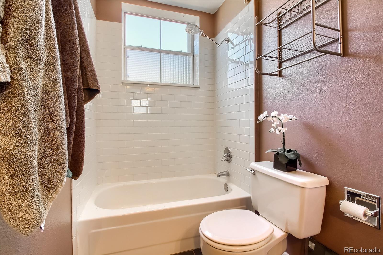 1300 Garfield Street, Unit 2 Denver, CO 80206 - Photo 21 of 34 a bathroom with a toilet sink and bathtub