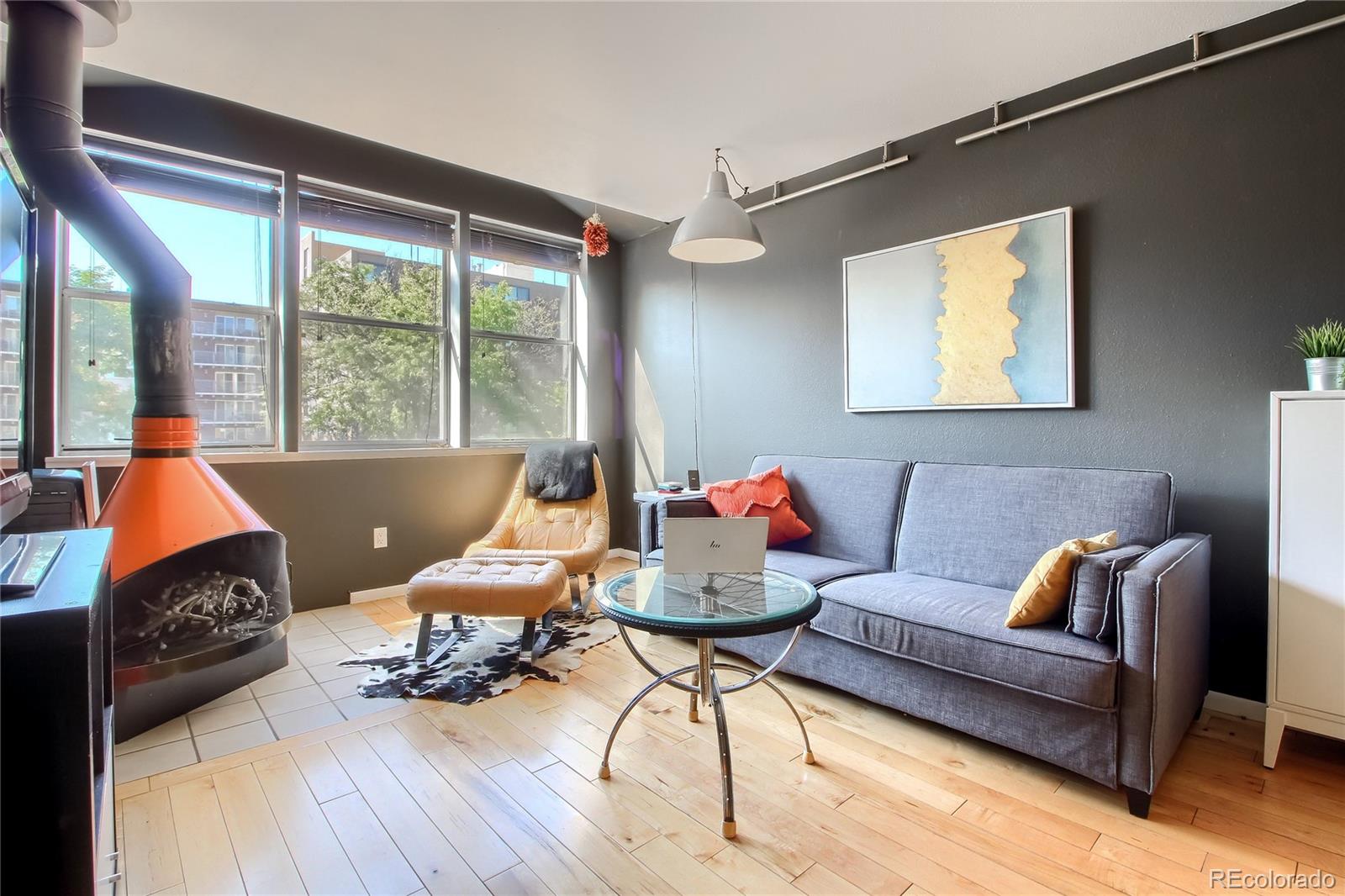 1300 Garfield Street, Unit 2 Denver, CO 80206 - Photo 3 of 34 a living room with furniture and a wooden floor