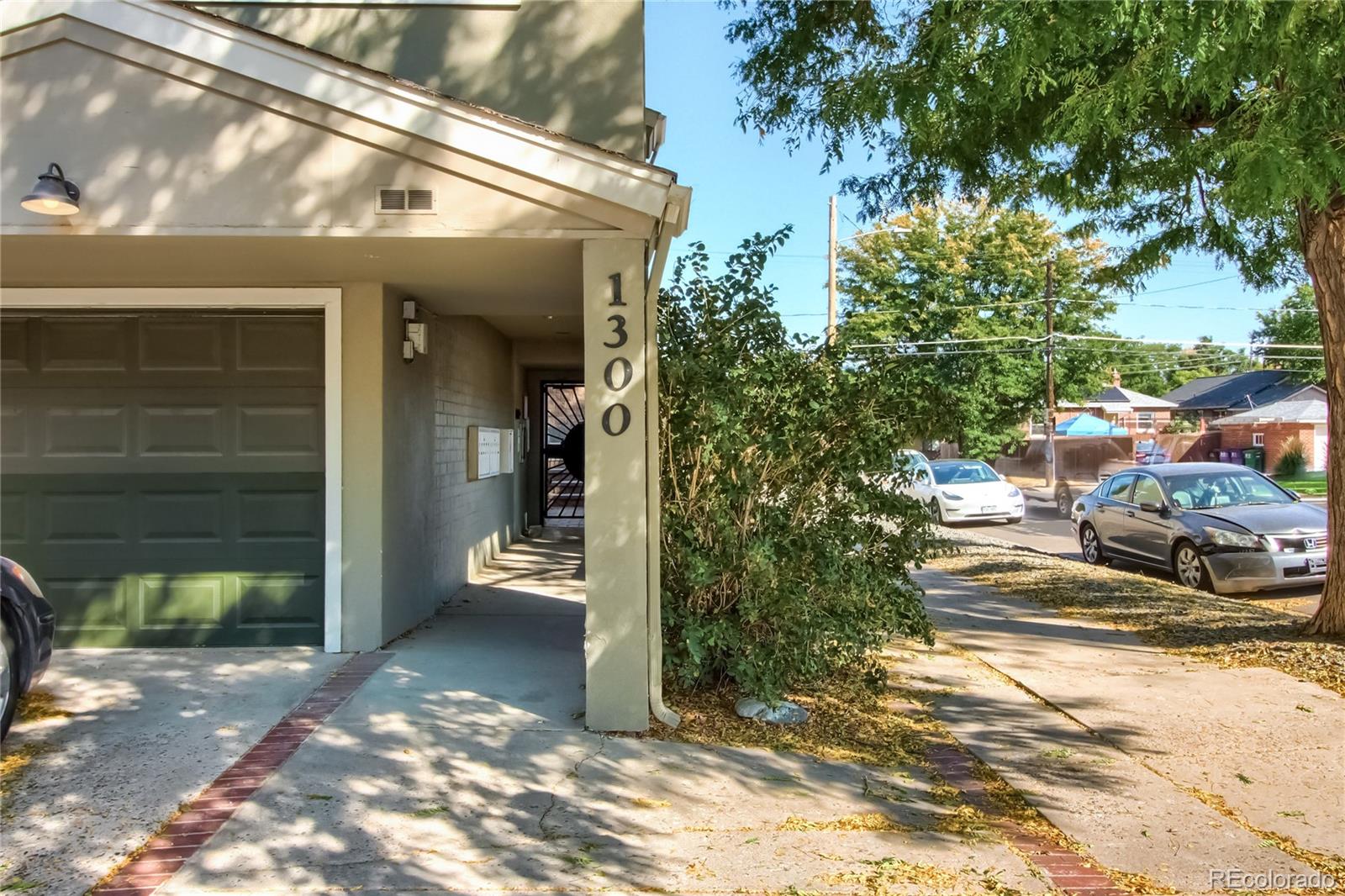 1300 Garfield Street, Unit 2 Denver, CO 80206 - Photo 33 of 34 a view of parking area and car parked
