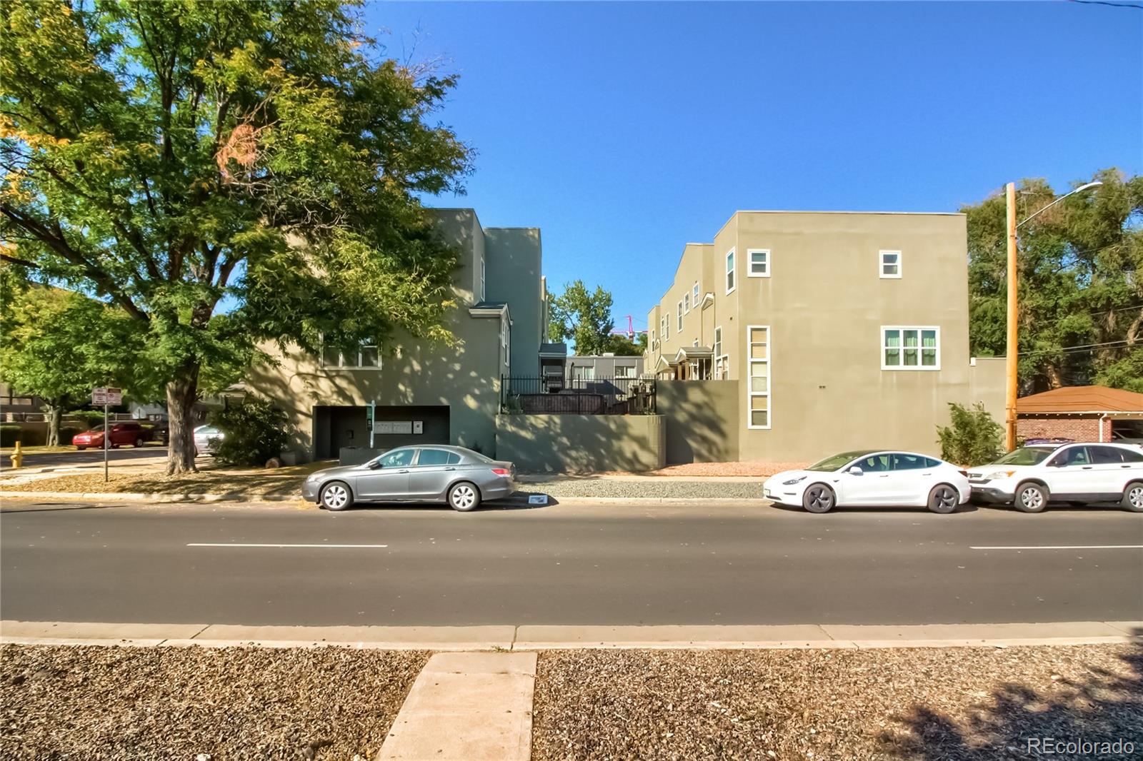 1300 Garfield Street, Unit 2 Denver, CO 80206 - Photo 34 of 34 a car parked on the side of the road
