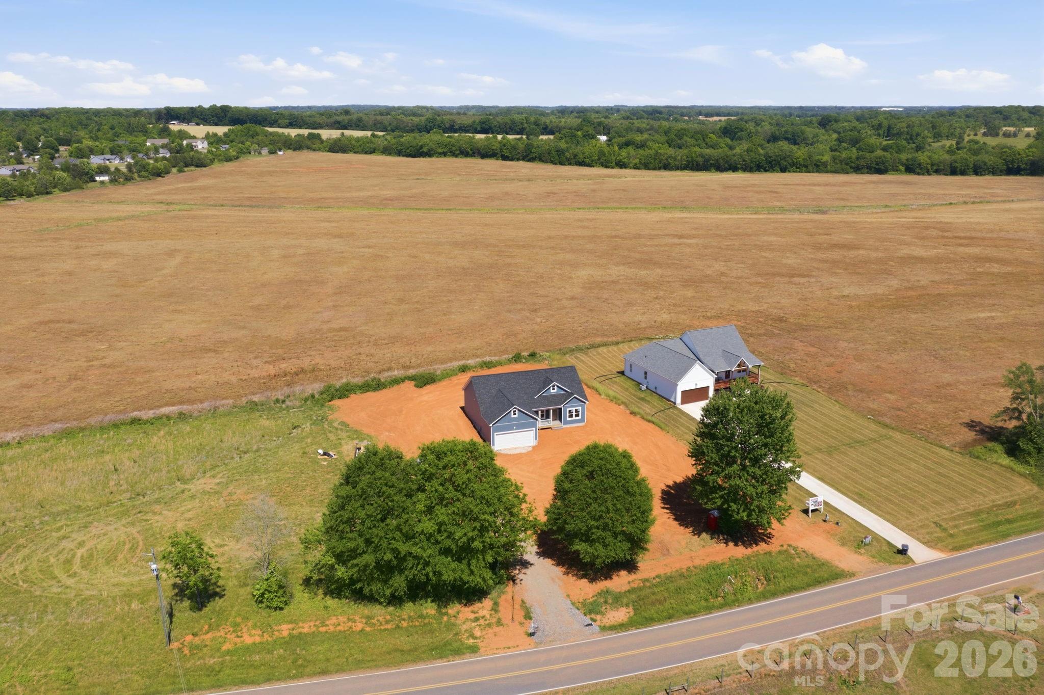 1720 Jennings Road Olin, NC 28660 - Photo 3 of 15 an aerial view of ocean and residential houses with outdoor space