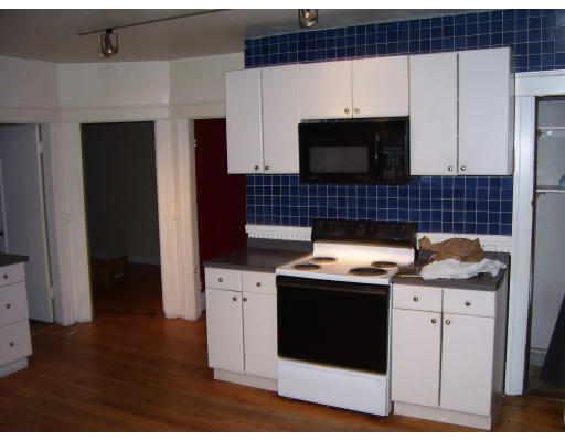 24 Colonial Road Worcester, MA 01602 - Photo 4 of 11 a kitchen with a stove and a microwave
