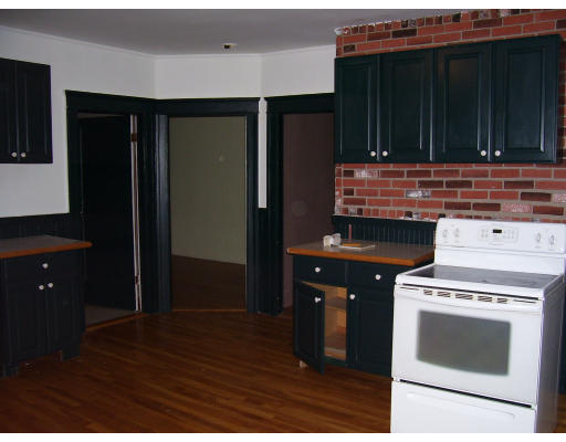 24 Colonial Road Worcester, MA 01602 - Photo 5 of 11 a kitchen with cabinets and appliances