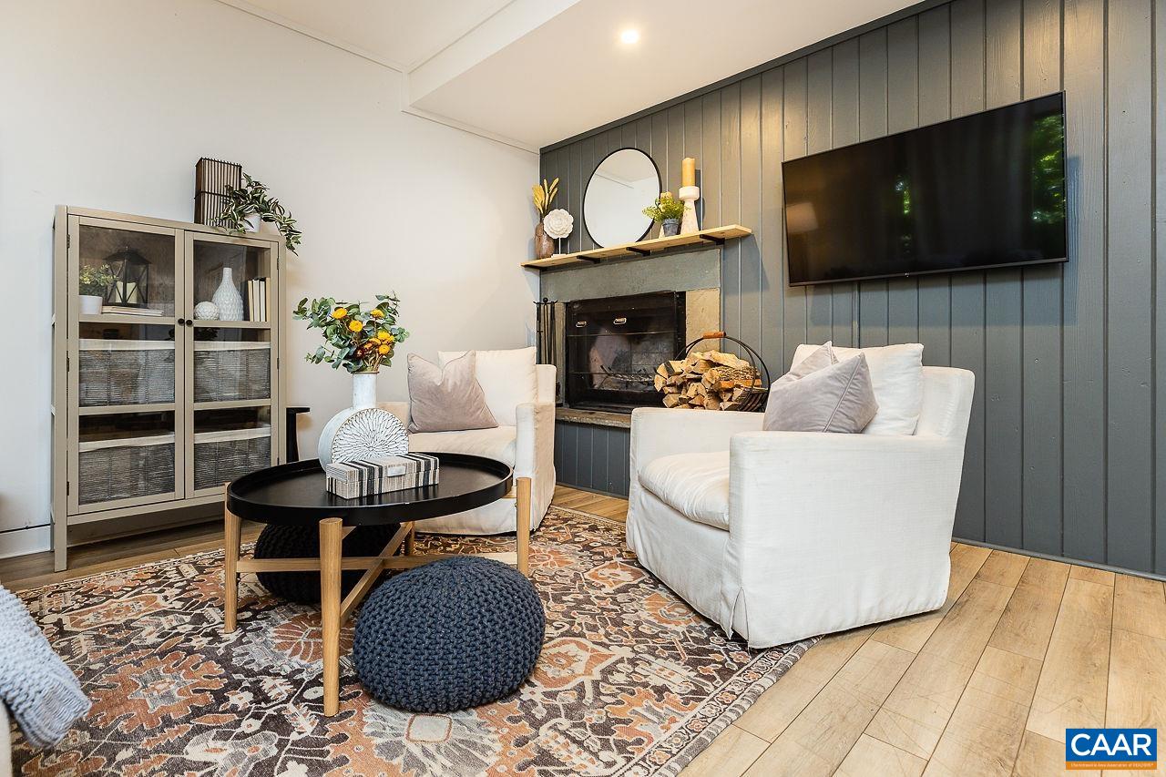 449 3 Ridges Wintergreen, VA 22967 - Photo 1 of 21 a living room with furniture a flat screen tv and a fireplace