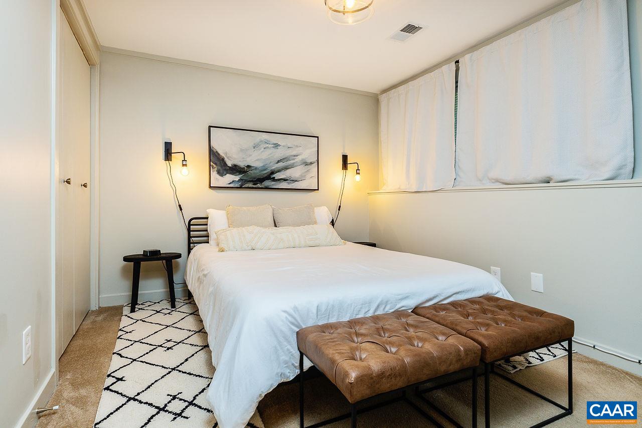 449 3 Ridges Wintergreen, VA 22967 - Photo 13 of 21 a bedroom with a bed and a table in it