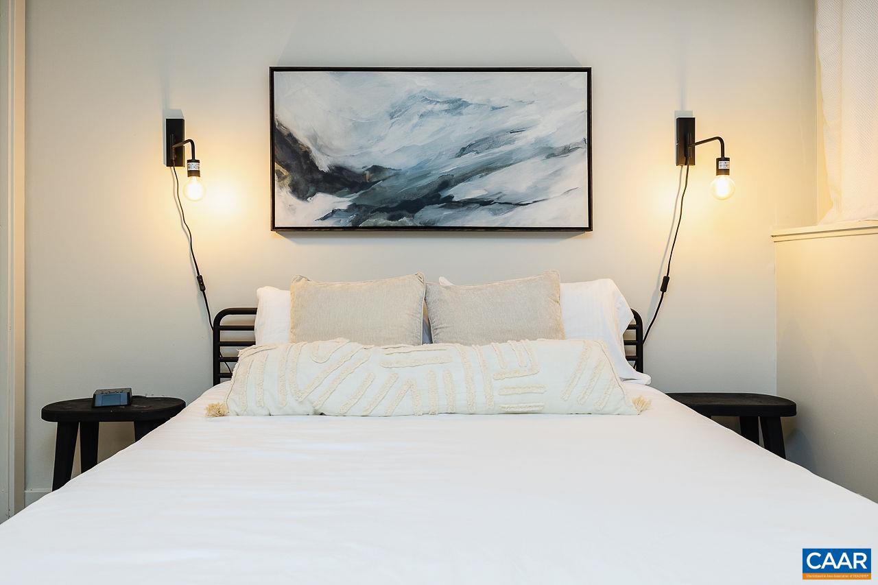 449 3 Ridges Wintergreen, VA 22967 - Photo 14 of 21 a bedroom with a bed and a painting on the wall