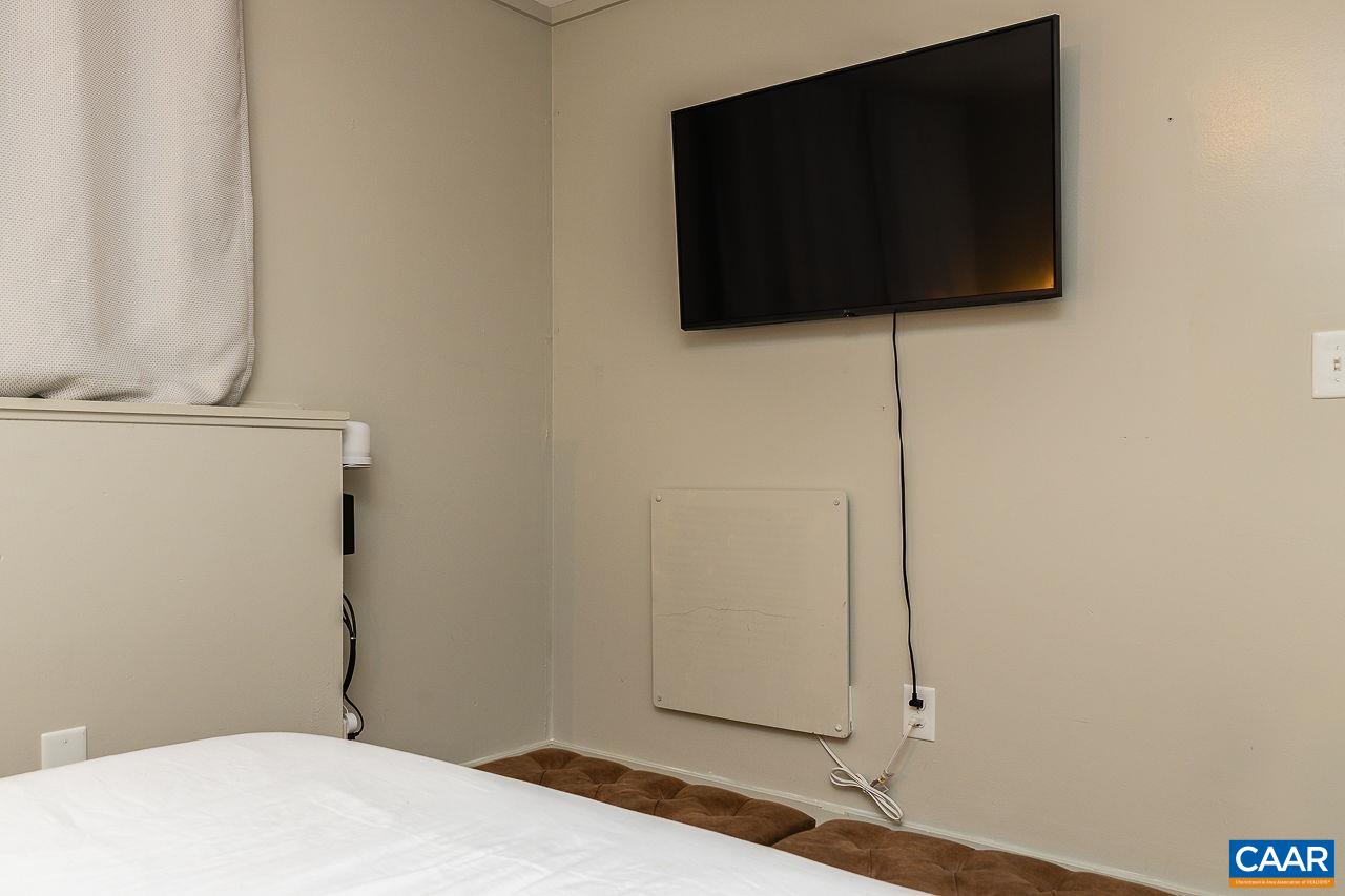 449 3 Ridges Wintergreen, VA 22967 - Photo 15 of 21 a bedroom with a bed and a flat screen tv