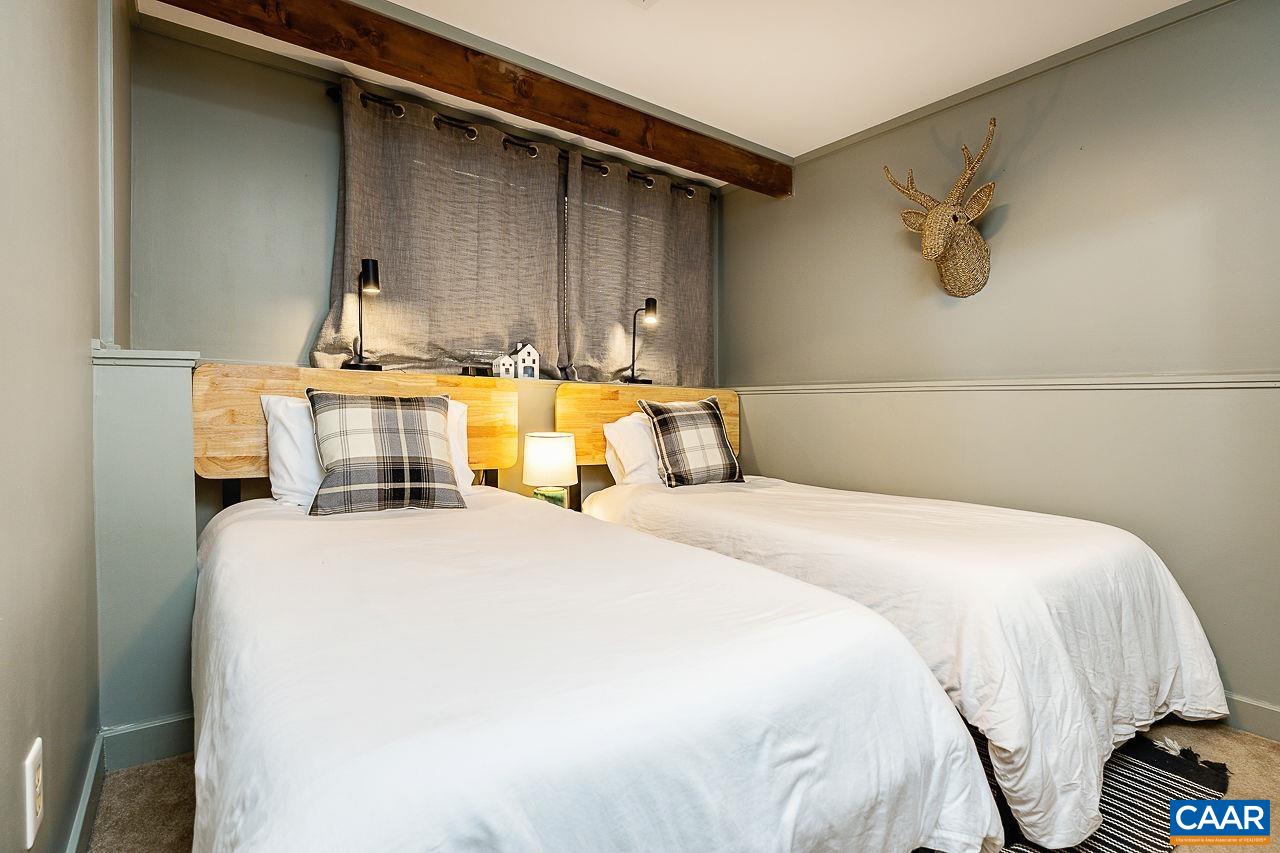 449 3 Ridges Wintergreen, VA 22967 - Photo 16 of 21 a bedroom with a bed and wooden floor