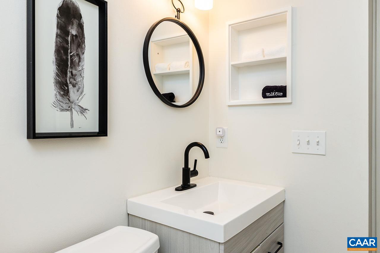 449 3 Ridges Wintergreen, VA 22967 - Photo 18 of 21 a bathroom with a toilet sink and mirror