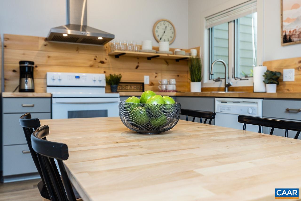 449 3 Ridges Wintergreen, VA 22967 - Photo 8 of 21 a room with a table chairs and a chandelier