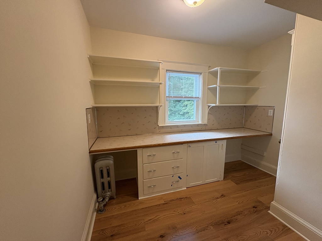 97 Warwick Road, Unit 97 Newton, MA 02465 - Photo 20 of 24 a room with a desk and a window