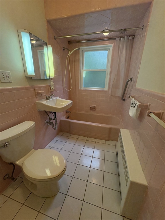 97 Warwick Road, Unit 97 Newton, MA 02465 - Photo 7 of 24 a bathroom with a sink a toilet and mirror
