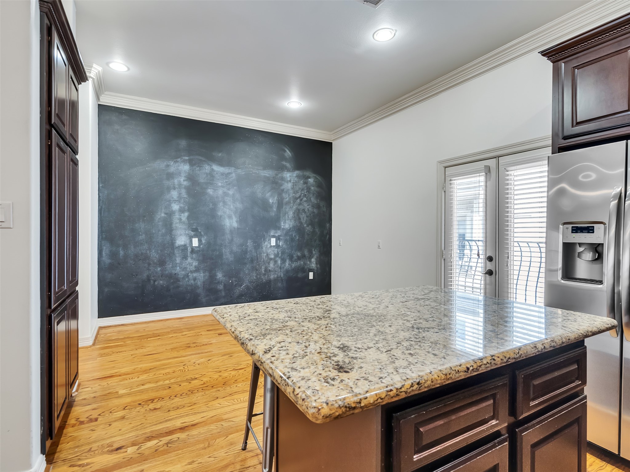 2540 Prospect Street, Unit B Houston, TX 77004 - Photo 11 of 37 a kitchen with kitchen island a sink a stove and wooden floor