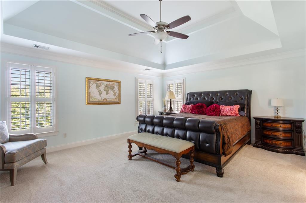 3522 Ivy Manor Road Southeast Smyrna, GA 30080 - Photo 15 of 47 a bedroom with a bed and a chandelier
