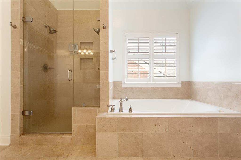 3522 Ivy Manor Road Southeast Smyrna, GA 30080 - Photo 19 of 47 a bathroom with a bathtub and shower