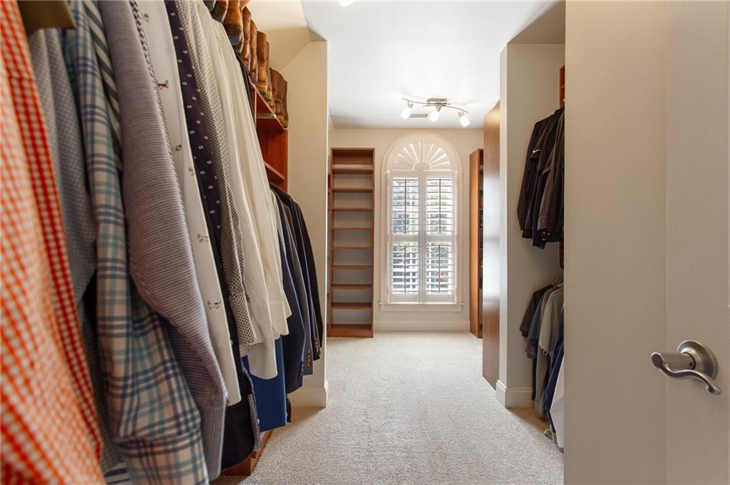 3522 Ivy Manor Road Southeast Smyrna, GA 30080 - Photo 20 of 47 a view of walk in closet with clothes and shoes