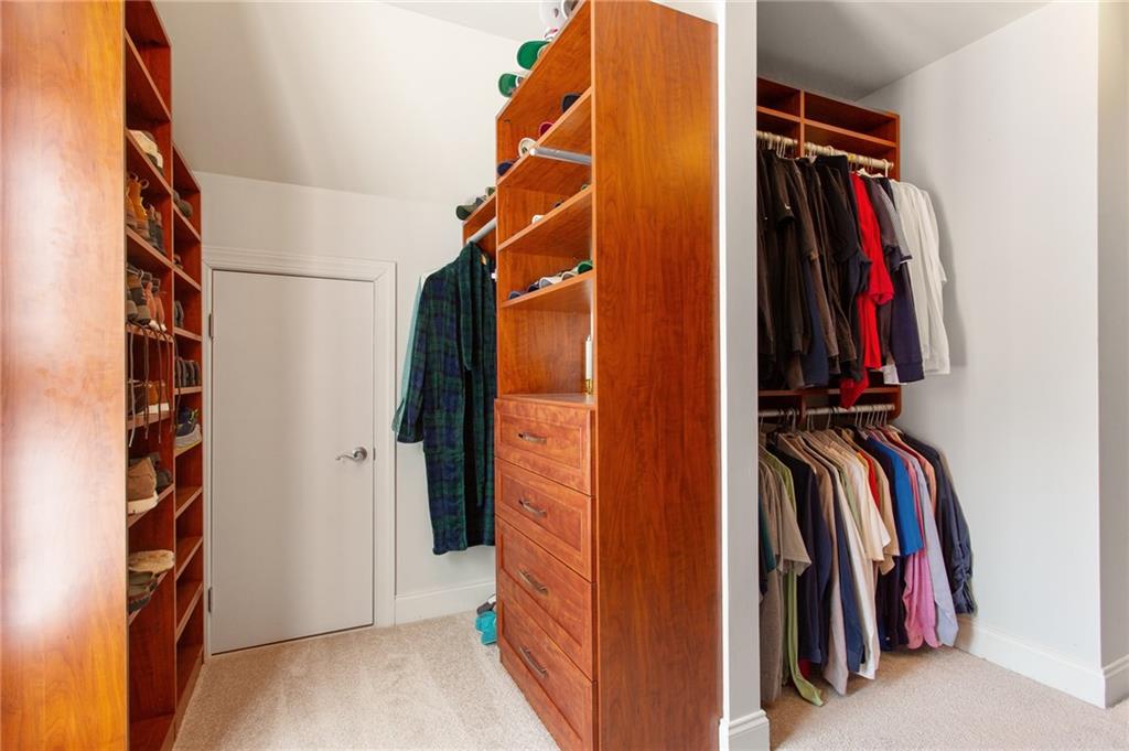 3522 Ivy Manor Road Southeast Smyrna, GA 30080 - Photo 21 of 47 a view of walk in closet with clothes and shoes