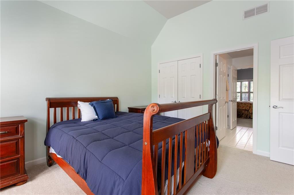 3522 Ivy Manor Road Southeast Smyrna, GA 30080 - Photo 23 of 47 a bedroom with a bed and a table