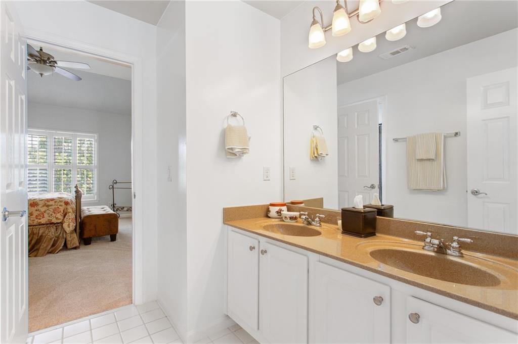3522 Ivy Manor Road Southeast Smyrna, GA 30080 - Photo 24 of 47 a spacious bathroom with a sink double vanity and a mirror