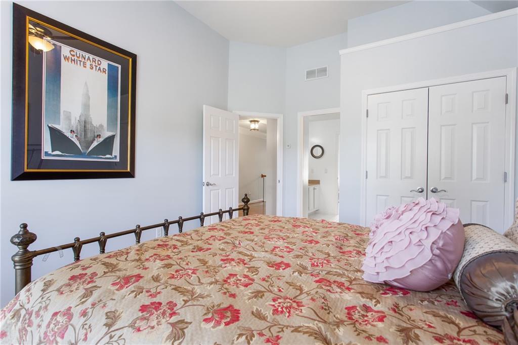 3522 Ivy Manor Road Southeast Smyrna, GA 30080 - Photo 29 of 47 a bedroom with a bed and a painting on the wall