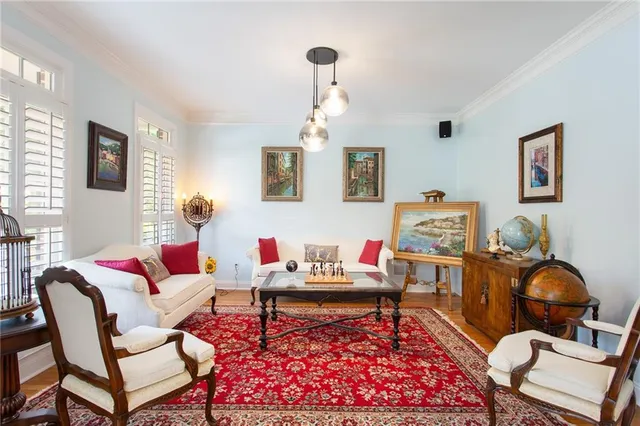 a living room with furniture rug and window