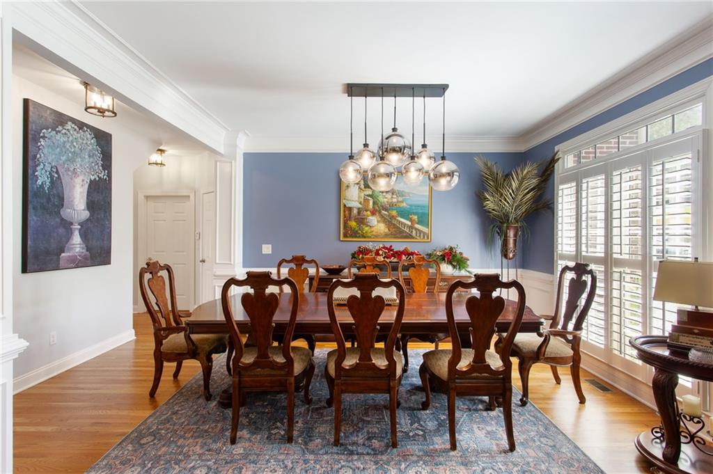 3522 Ivy Manor Road Southeast Smyrna, GA 30080 - Photo 4 of 47 a view of a dining room with furniture and chandelier