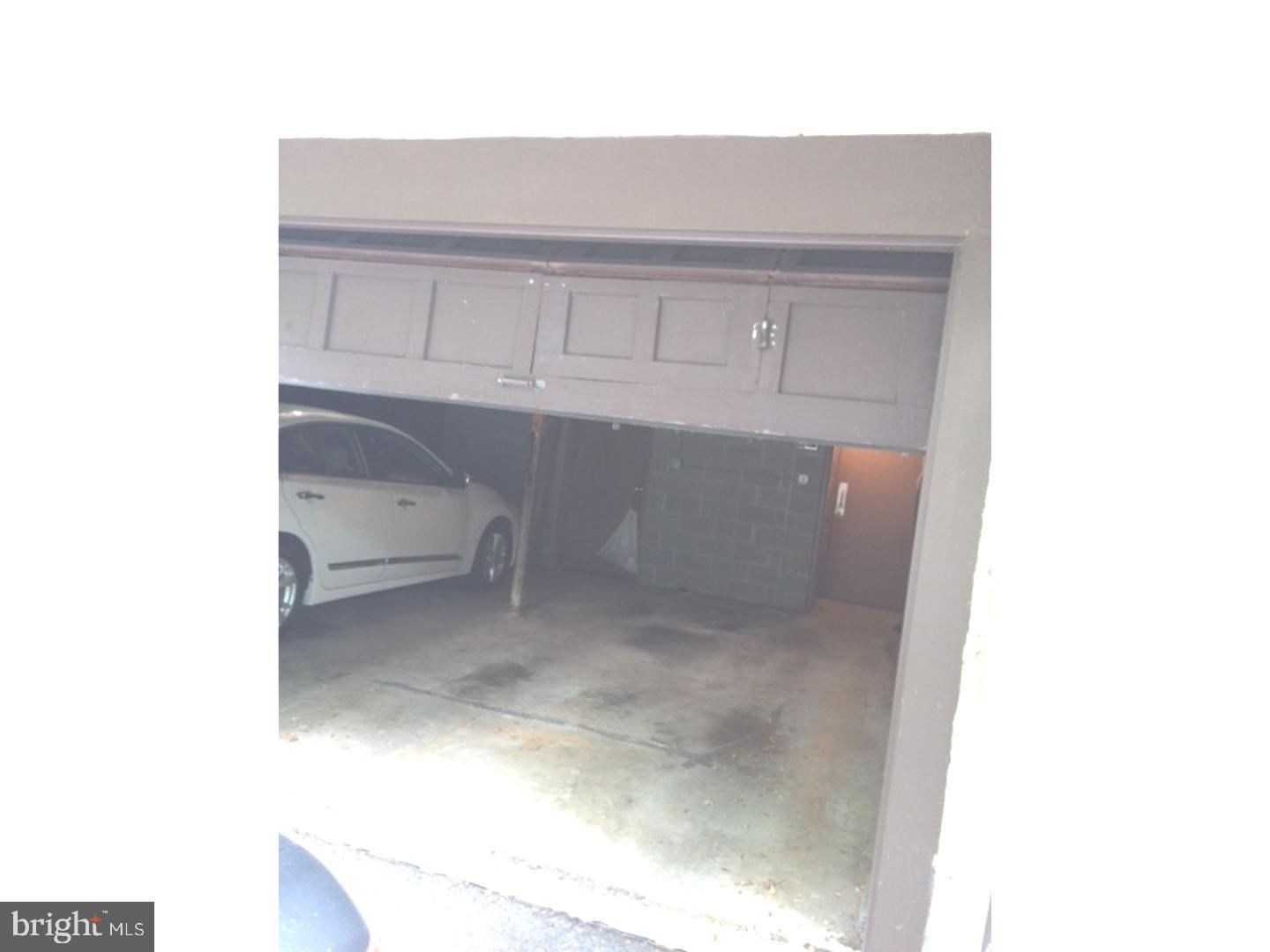 233 Township Line Road, Unit 4B Elkins Park, PA 19027 - Photo 17 of 19 Rear garage with steps to 1st flr unit