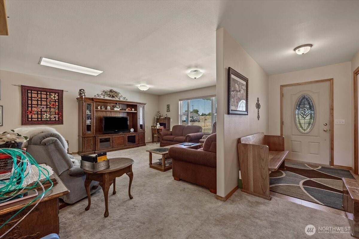 157209 West North River Road Prosser, WA 99350 - Photo 3 of 40 a living room with furniture a couch and a flat screen tv