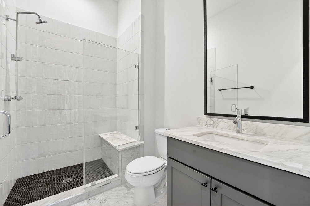 2707 Salek View Austin, TX 78741 - Photo 28 of 39 Bathroom with vanity and a shower stall