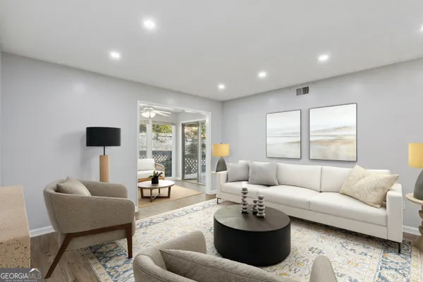 a living room with furniture and a large window