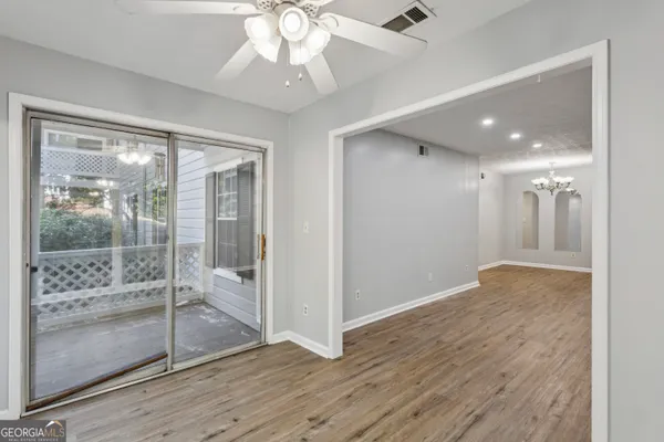 a view of a hallway with a chandelier