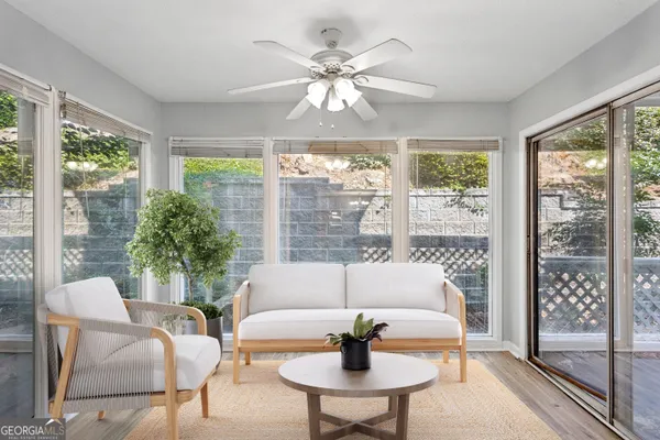 a living room with furniture and a large window
