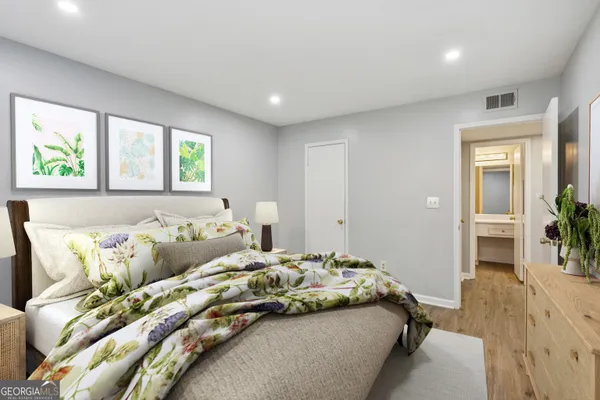 a bedroom with a bed and a couch