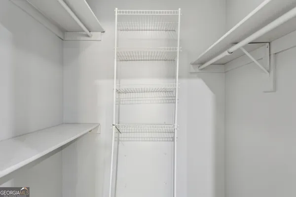 a view of an empty walk in closet