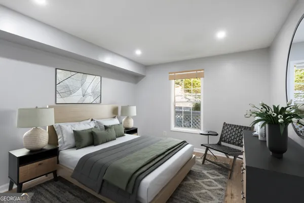 a bedroom with bed and a window