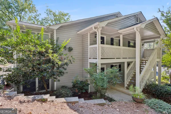 a front view of a house with plants