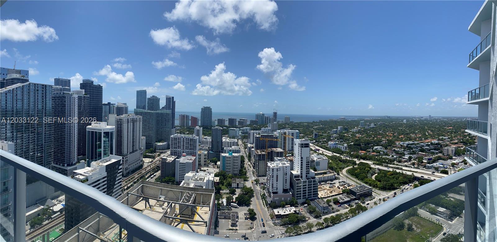 185 Southwest 7th Street, Unit 4206 Miami, FL 33130 - Photo 4 of 26 a view of a city from a balcony