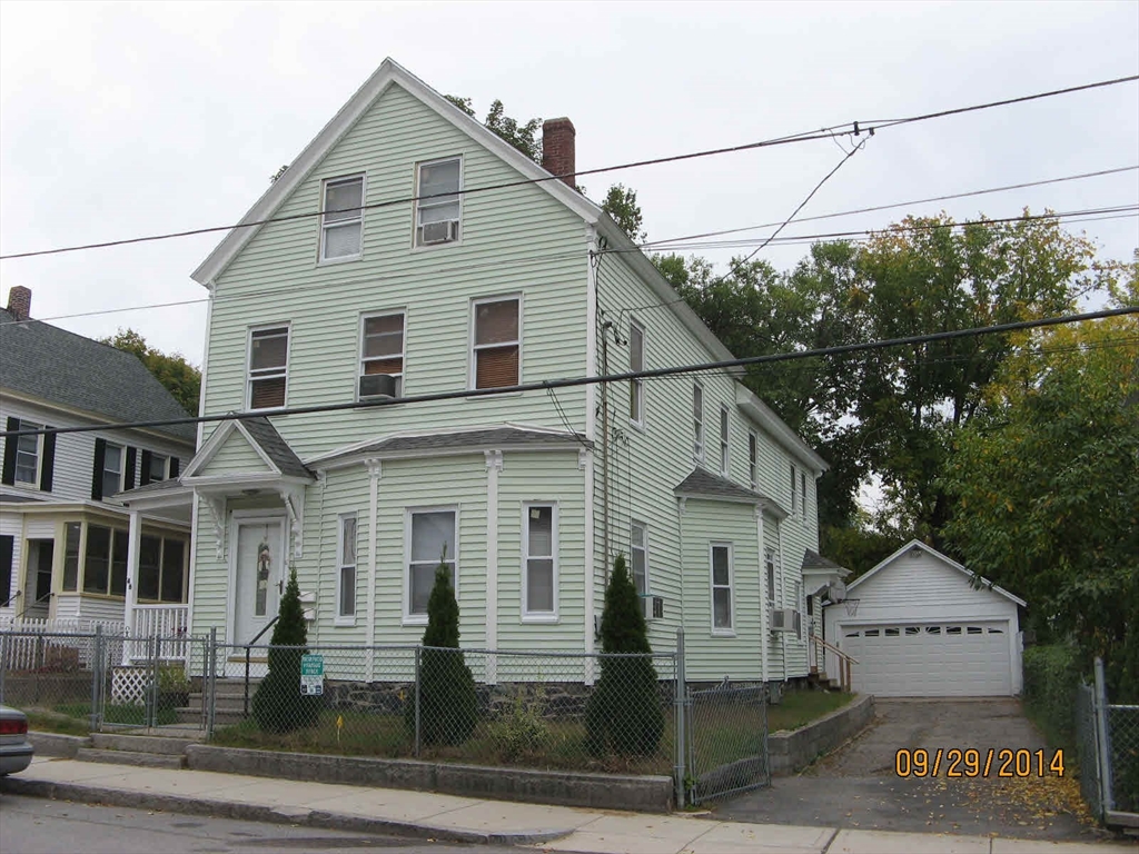 46 Lane Street, Unit 1 Lowell, MA 01851 - Photo 1 of 19 a view of a white house