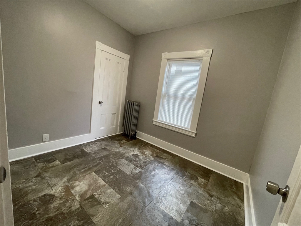 46 Lane Street, Unit 1 Lowell, MA 01851 - Photo 7 of 19 an empty room with windows