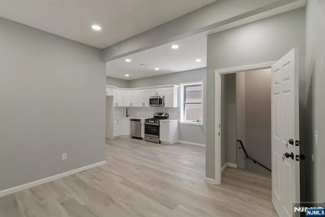 a view of a kitchen with wooden floor