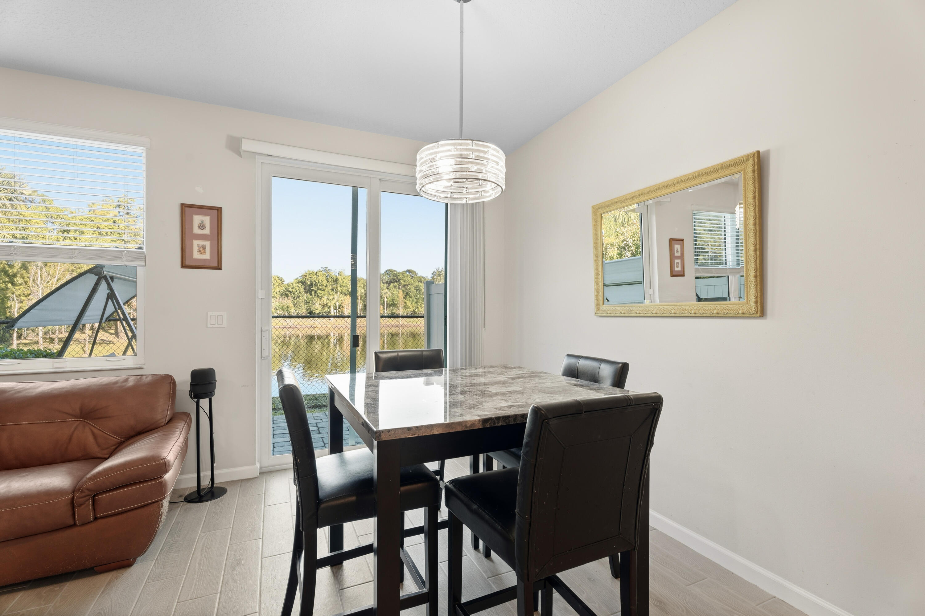3931 Southeast Mentmore Lane Stuart, FL 34997 - Photo 11 of 33 a view of a dining room with furniture window and outside view