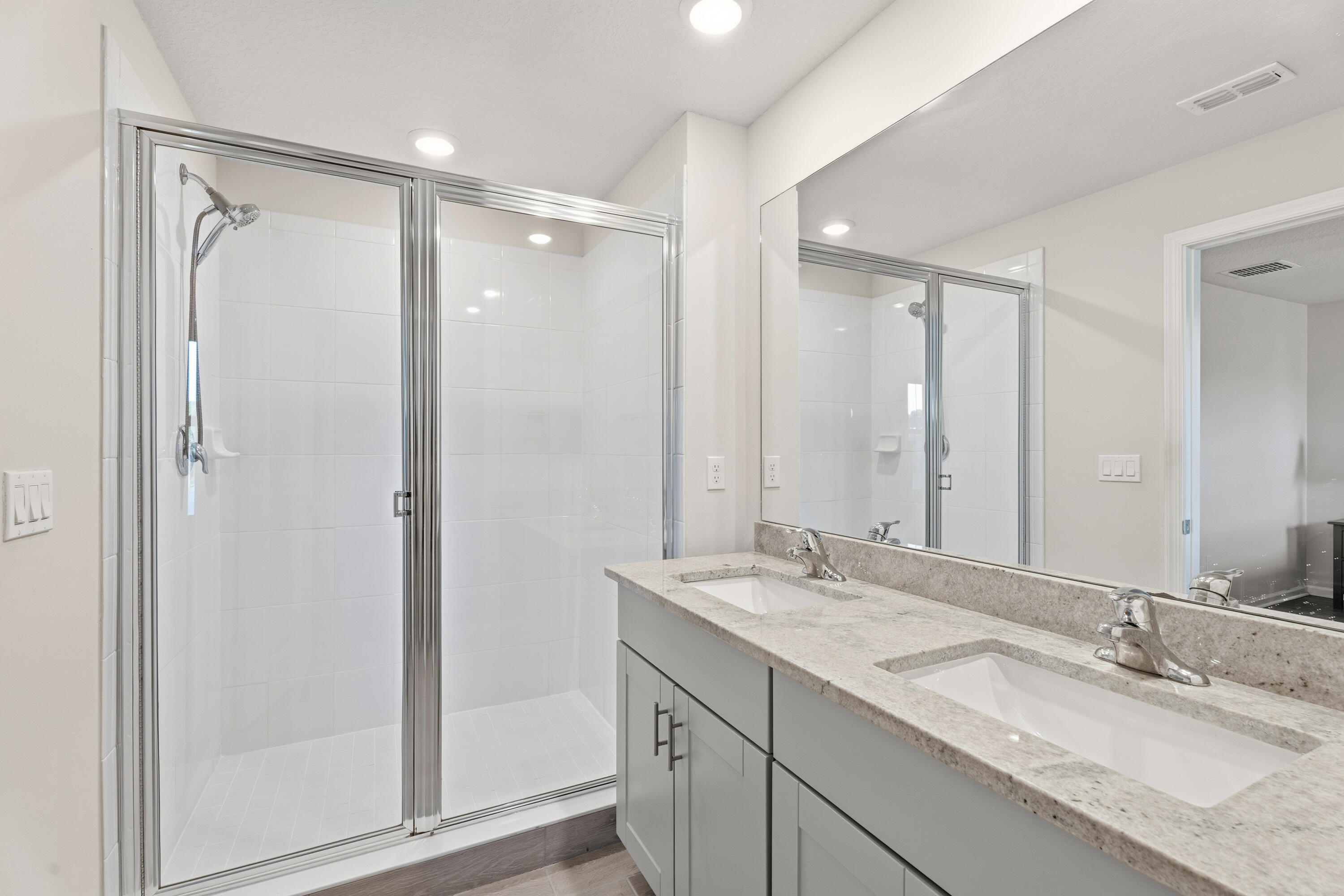 3931 Southeast Mentmore Lane Stuart, FL 34997 - Photo 17 of 33 a bathroom with a granite countertop sink mirror and double