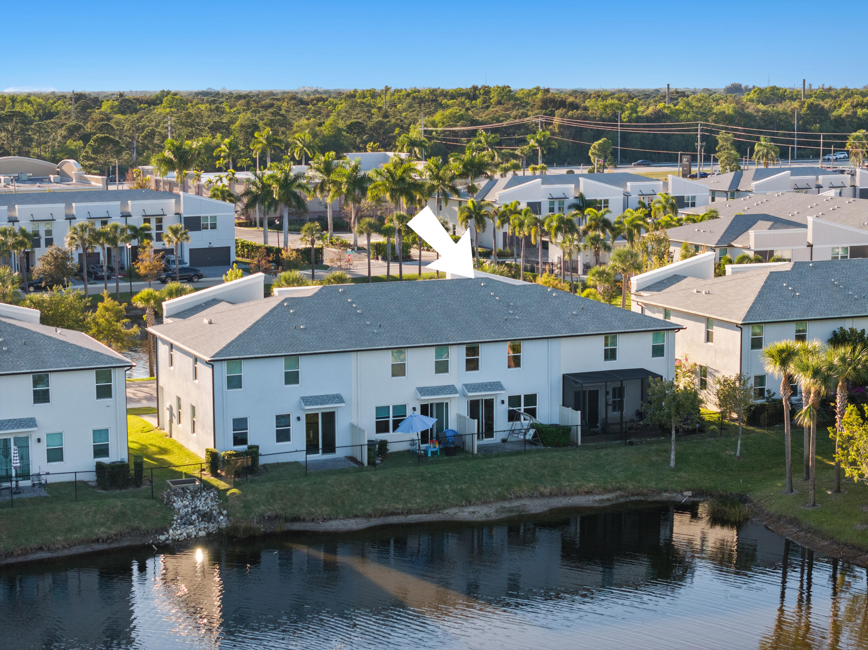 3931 Southeast Mentmore Lane Stuart, FL 34997 - Photo 2 of 33 a view of a town with large trees and buildings