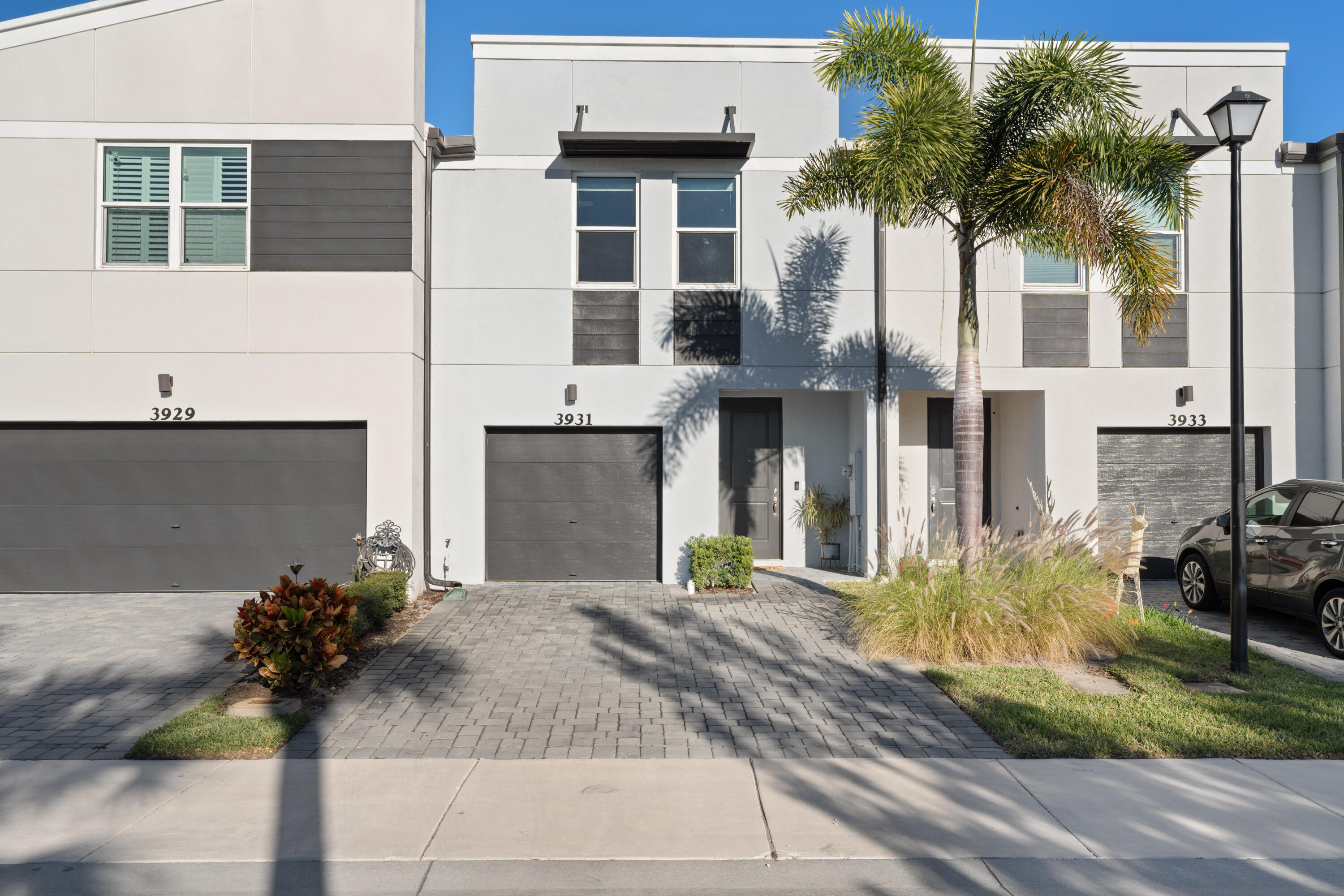 3931 Southeast Mentmore Lane Stuart, FL 34997 - Photo 24 of 33 a front view of a house with garden