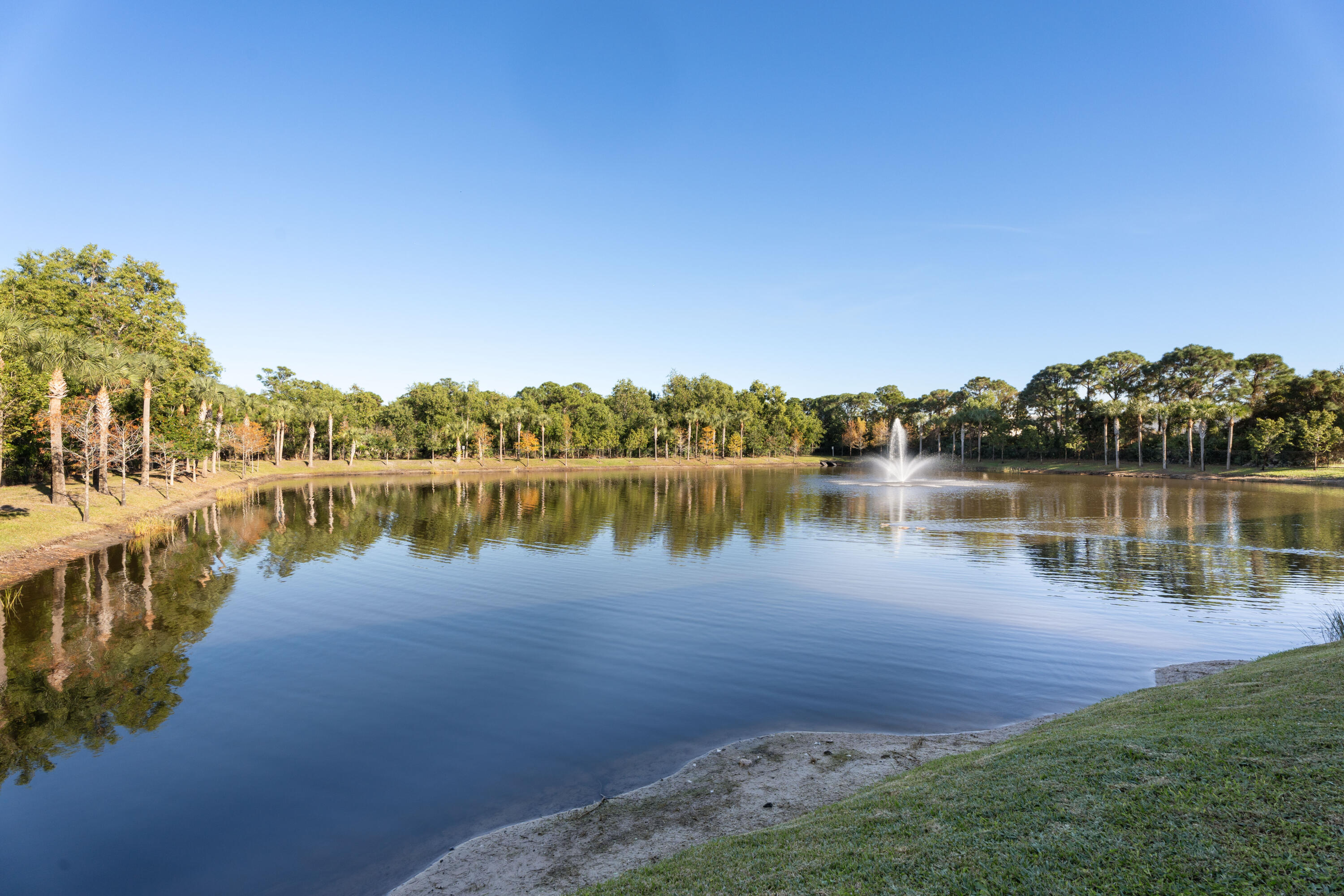 3931 Southeast Mentmore Lane Stuart, FL 34997 - Photo 5 of 33 a view of a lake with houses in the background