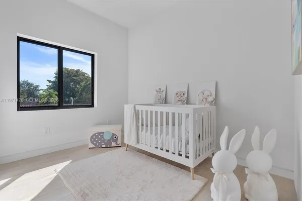 a view of a livingroom with an empty space and a window