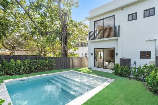 a kitchen with stainless steel appliances a stove sink and microwave