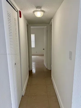 a view of a bathroom from the hallway