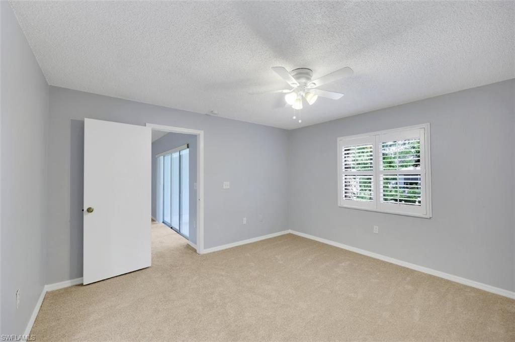 5685 Whitaker Road, Unit 202 Naples, FL 34112 - Photo 13 of 26 Plantation shutters to double window
